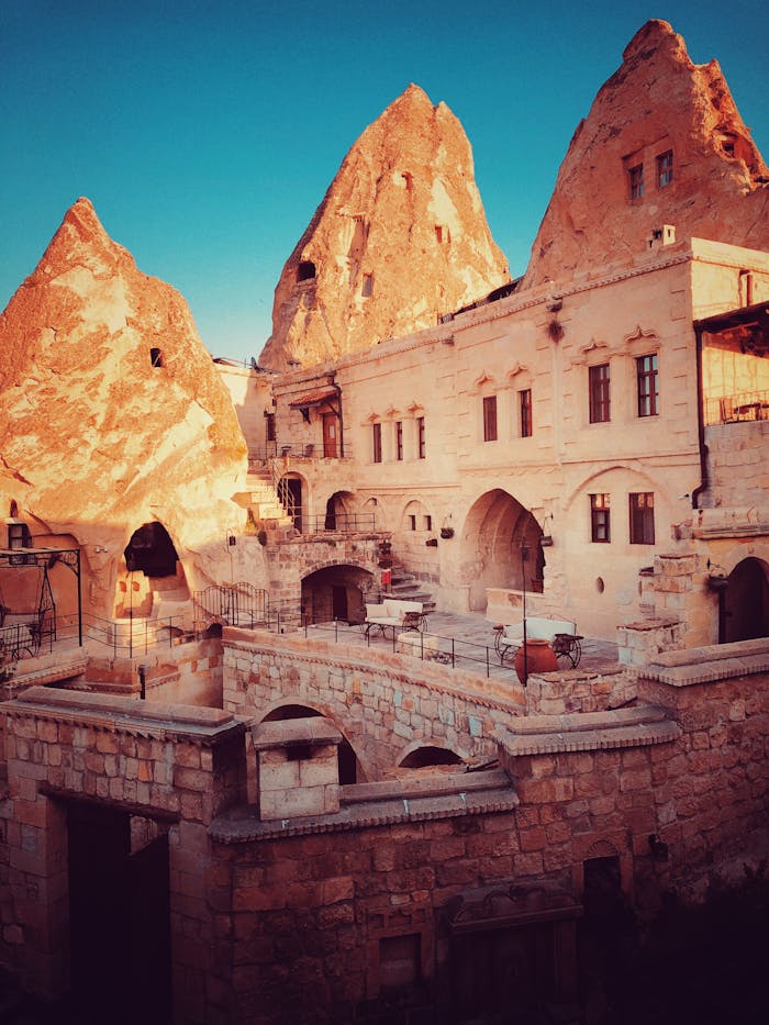 Scenic view of Cappadocias unique cave dwellings and rock formations at sunset.